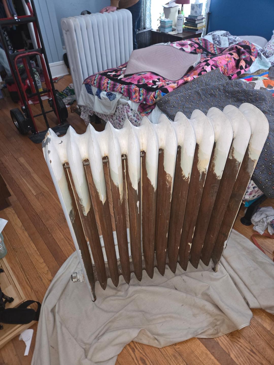 Worn cast iron radiator before restoration